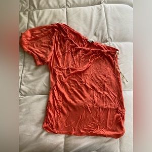 A one sleeved shirt that fits well and is lightweight and in perfect condition